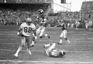 FILE - In this Dec. 28, 1975, file photo, Dallas Cowboy wide receiver Drew Pearson (88) nears the end zone on a game-winning 50-yard touchdown pass play in the fourth quarter of an NFL football game against the Minnesota Vikings in Bloomington, Minn. Pearson is headed to the Pro Football Hall of Fame as part of the class of 2021 after the disappointment of not getting in a year earlier. The former Cowboys receiver joins 1970s-era offensive teammates Roger Staubach and Tony Dorsett in the hall. (AP Photo/File)