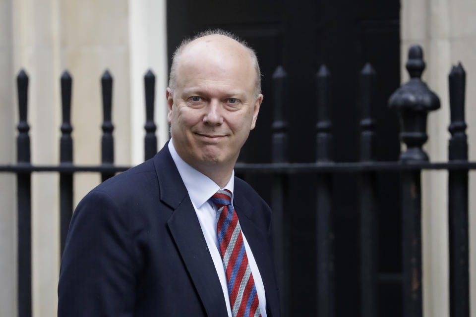 Britain's Transport Secretary Chris Grayling arrives for a cabinet meeting at 10 Downing Street in London, Tuesday, March 26, 2019. (AP Photo/Matt Dunham)