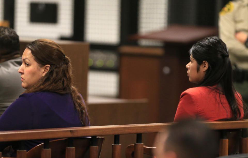 Candace Marie Brito, left. and Vanesa Zavala sit in the West Justice Center, Westminster, Calif., Monday, Feb. 10, 2014, at a preliminary hearing. The two are charged in the beating death of Kim Pham in front of a Santa Ana nightclub. (AP Photo/Los Angeles Times, Mark Boster, POOL).