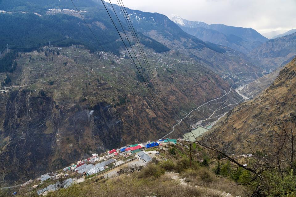 Kandar, a remote village that had to be resettled after rockslides damaged houses in the original village, sits perched above the Nathpa-Jhakri Power Project in Kinnaur district of the Himalayan state of Himachal Pradesh, India, Sunday, March 12, 2023. A favorite initiative of Indian governments, the push for dams has skyrocketed as the nation looks for round-the-clock energy that doesn't spew planet-warming emissions. (AP Photo/Ashwini Bhatia)