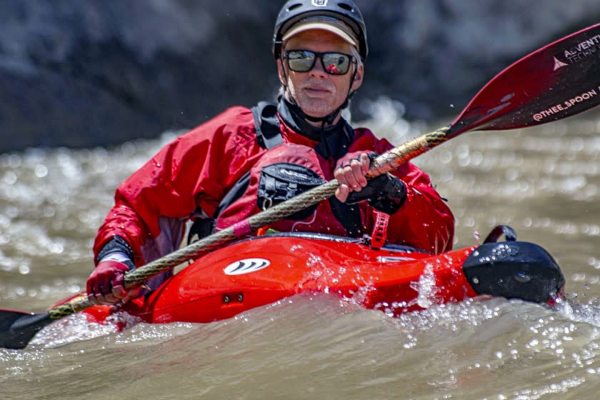 Writer Brian Clark paddles a hard-shell whitewater kayak on an OARS trip down the Yampa River near near the Colorado-Utah border. The Yampa flows west from its headwaters near Steamboat Springs and joins the Green River in Dinosaur National Monument.