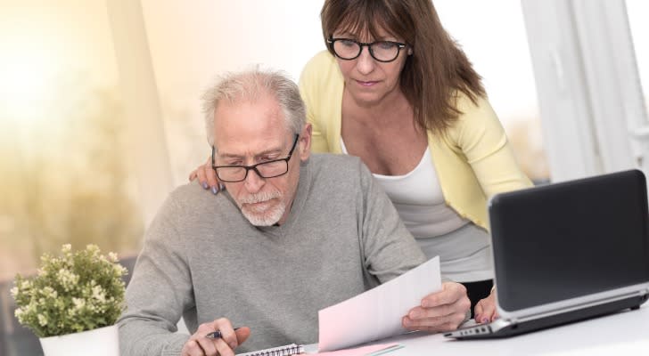 Couple looking at their retirement investments