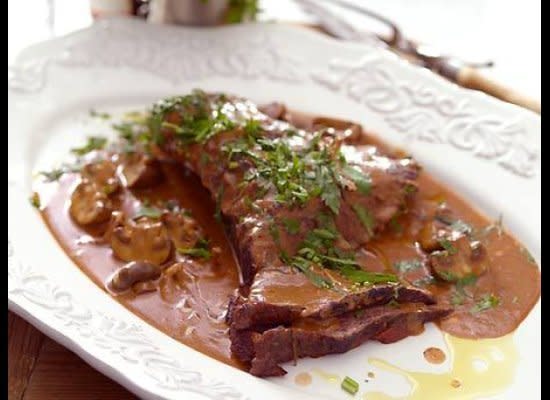 A classic brisket recipe will please everyone to no end. Here, the beef roasts slowly in the oven under tight cover with vegetables and wine until absolutely tender. Cook down the pan juices to make a rich sauce and add sauteed mixed mushrooms and sour cream (optional if you're keeping kosher). Serve with mashed potatoes.    <strong>Get the <a href="http://www.huffingtonpost.com/2011/10/27/braised-brisket-and-cream_n_1055088.html" target="_hplink">Braised Brisket and Creamy Mushrooms</a> recipe</strong>