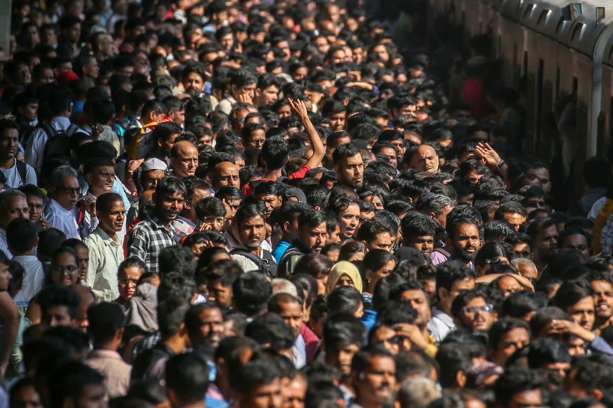 Representative: Indian commuters wait for the local train at Borivali railway station in Mumbai (EPA)