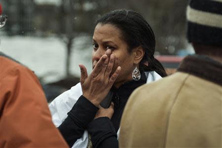 Tarah William of Lanham, Maryland reacts after she was evacuated from a building following a shooting at a shopping mall in Columbia, Maryland January 25, 2014. REUTERS/James Lawler Duggan