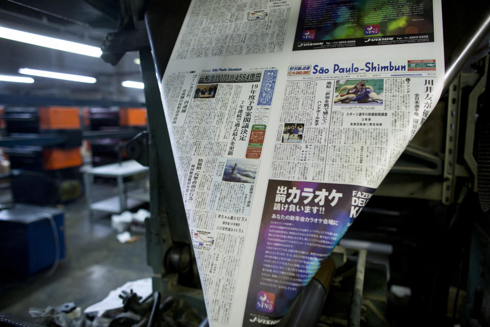 In this Dec. 21, 2018 photo, the Sao Paulo Shimbun Japanese newspaper is printed in Sao Paulo, Brazil. The Japanese-language newspaper, whose final edition rolled off the presses Jan. 1, 2019, was a victim of declining sales, an aging readership and the internet. (AP Photo/Victor R. Caivano)