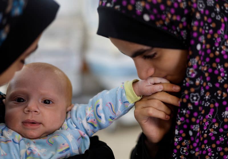 Separated by Israeli checkpoint, Gazan parents yearn to see their infant