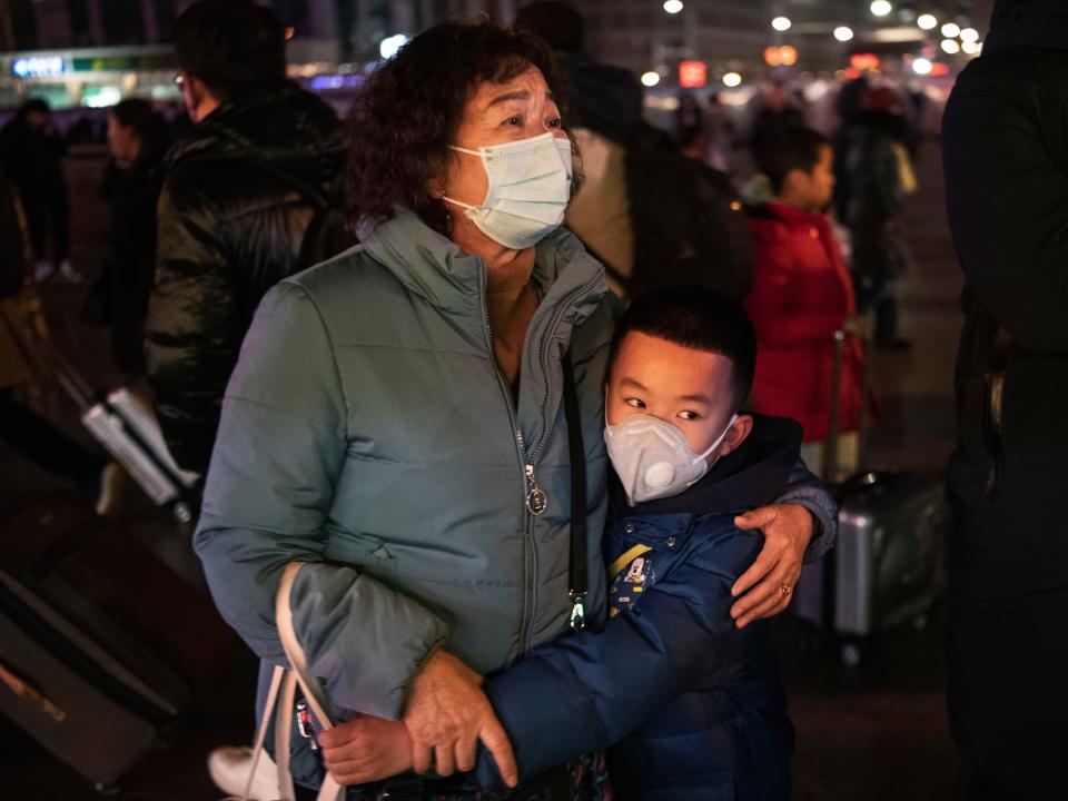 Chinese boy hugs relative amid coronavirus outbreak