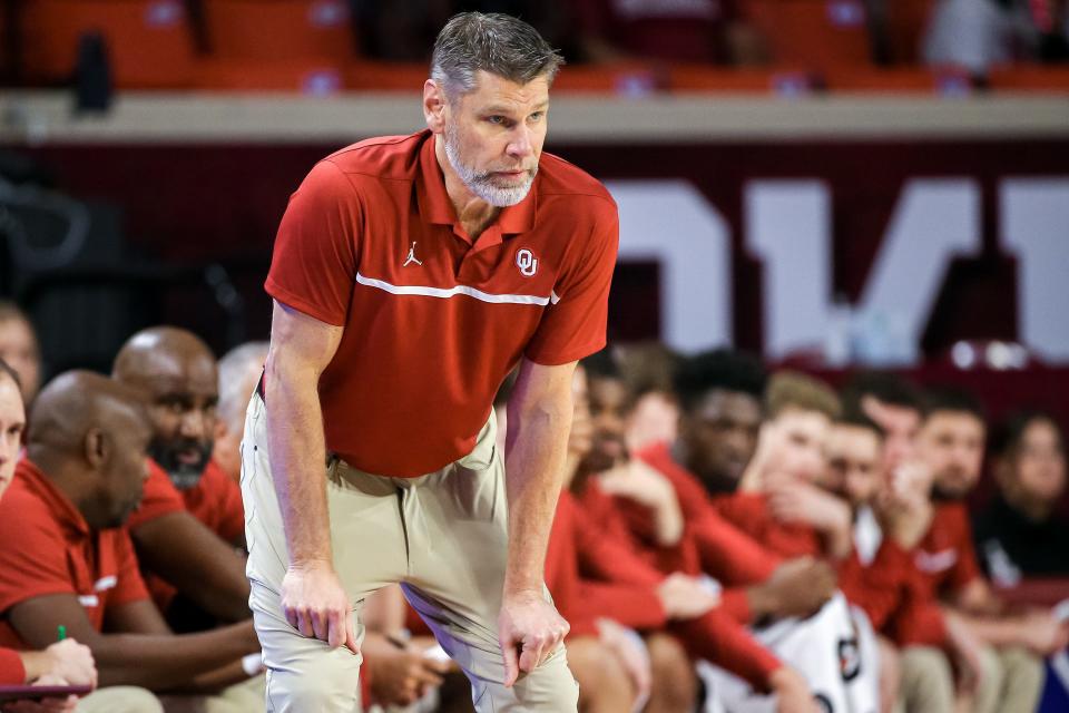 Coach Porter Moser will try to deliver the Sooners their first win at Kansas since 1993 on Tuesday.