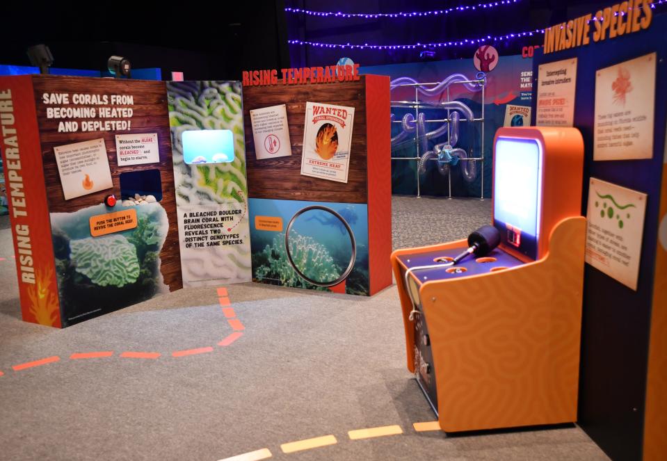 Mote Marine's new Mystery Reef exhibit sends kids on a scavenger hunt to gather clues about what is hurting coral reefs. Exhibits explain threats to coral reefs from rising water temperature and invasive species.