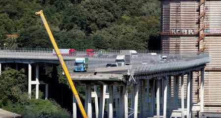 The collapsed Morandi Bridge is seen in the Italian port city of Genoa, Italy August 15, 2018. REUTERS/Stefano Rellandini