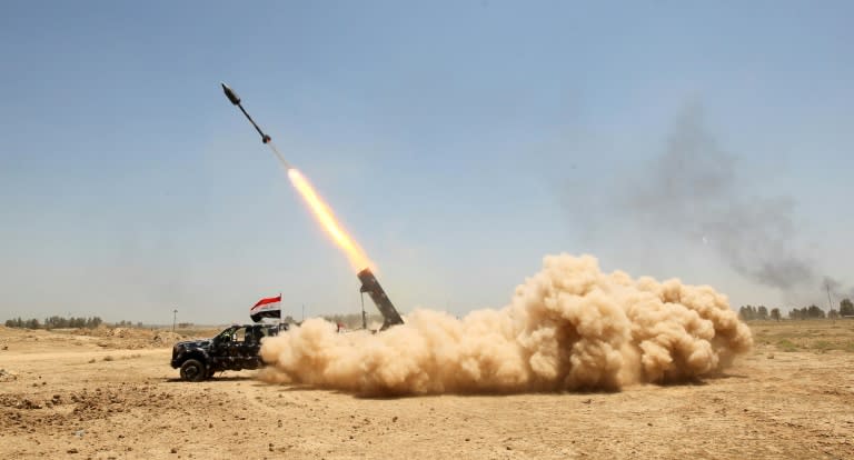 Pro-government forces fire a rocket during an offensive to retake the city of Fallujah, from the Islamic State (IS) group