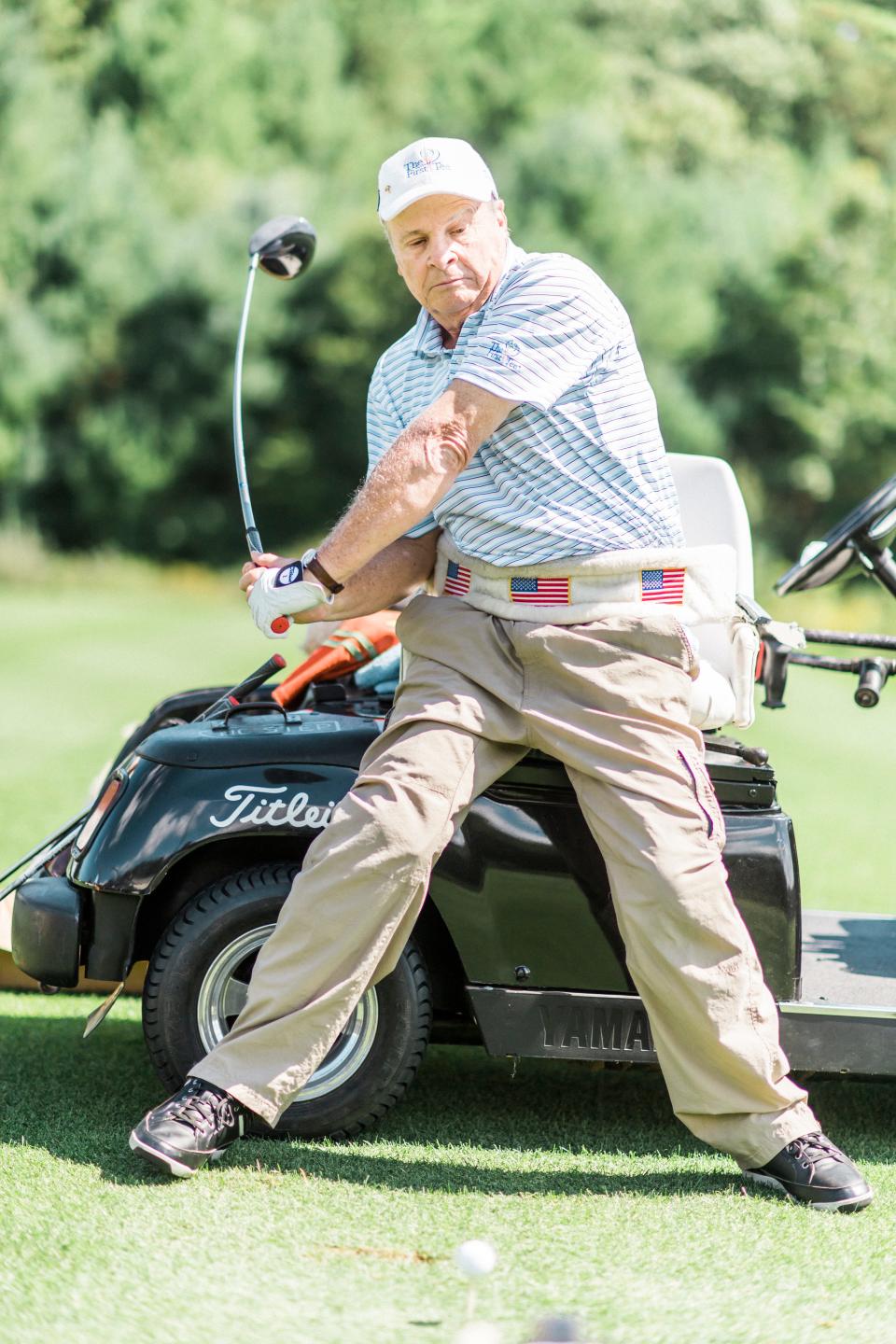 Dennis Walters, performing his trick shots from his special golf cart, has won PGA and USGA awards.