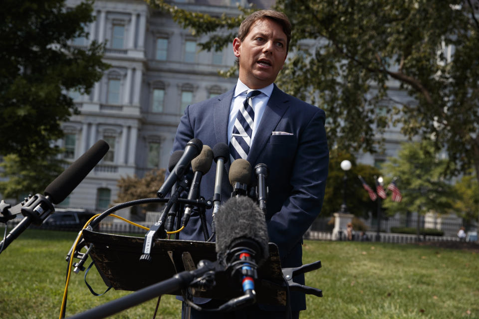 Deputy White House press secretary Hogan Gidley talks with reporters about outgoing national security adviser John Bolton outside the White House, Tuesday, Sept. 10, 2019, in Washington. (AP Photo/Evan Vucci)