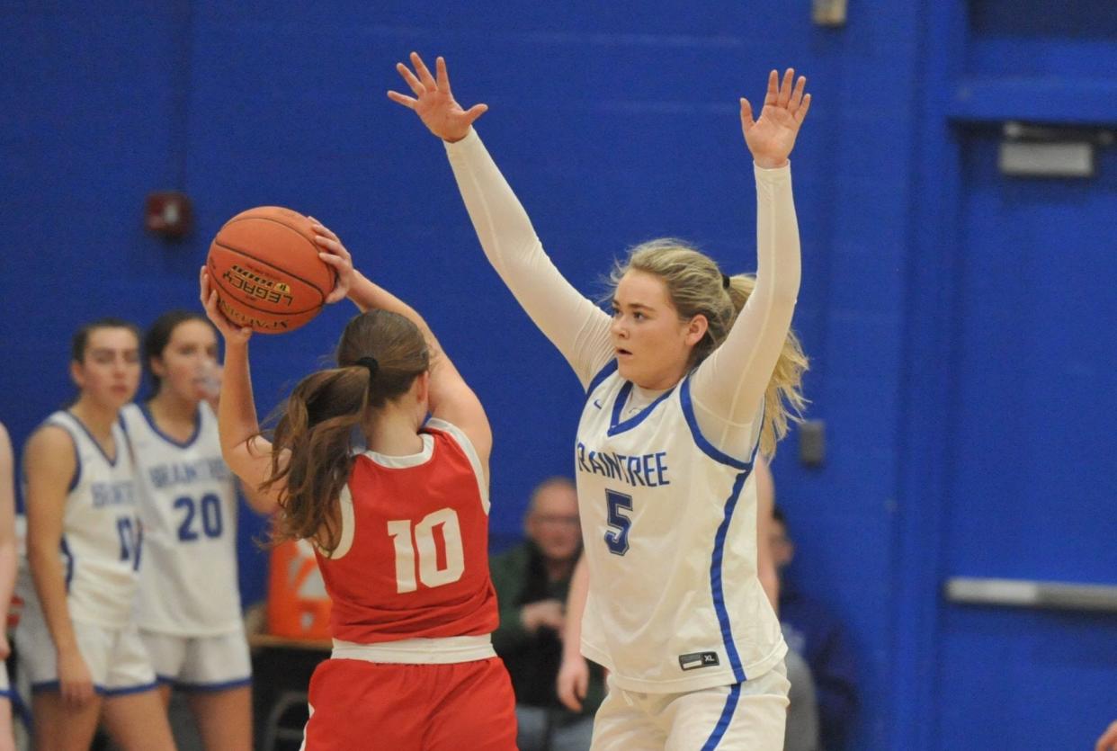 Braintree's Ava MacDonald, right, tries to block Milton's Grace Pater, left, during girls high school basketball action at Braintree High School, Tuesday, Feb. 20, 2024.