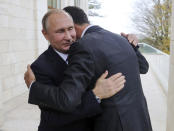 FILE - Russian President Vladimir Putin, left, embraces Syrian President Bashar Assad in the Bocharov Ruchei residence in the Black Sea resort of Sochi, Russia, Nov. 20, 2017. Political observers say Russia’s brazen Syria intervention emboldened Putin, giving him a renewed Middle East foothold and helped pave the way for his current attack on Ukraine. (Mikhail Klimentyev, Kremlin Pool Photo via AP, File)