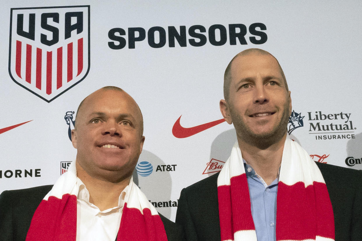 FILE - In this Dec. 4, 2018, file photo, Earnie Stewart, general manager of the U.S. men's national soccer team, and head coach Gregg Berhalter pose at a news conference in New York. The sporting director of the U.S. Soccer Federation says Gregg Berhalter's job is safe as men's national team coach despite some disappointing results. 