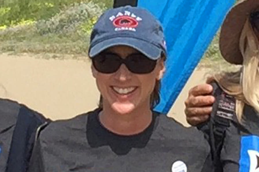 This 2017 photo provided by Heal The Bay shows Marybeth Guiney during a Heal The Bay beach cleanup project at Will Rogers State Beach in the Pacific Palisades area of Los Angeles. Guiney was among the 34 people who died aboard the dive boat Conception near Santa Cruz Island on Sept. 2, 2019. (Heal The Bay via AP)