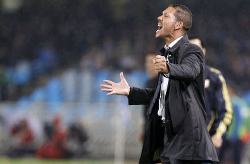 Atletico Madrid's coach Argentinian Diego Simeone reacts during the Spanish league football match Real Sociedad vs Atletico de Madrid at the Anoeta stadium in San Sebastian. Radamel Falcao scored a stunning last-minute free-kick to give Atletico Madrid a 1-0 win