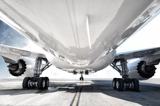 <p>Getty</p> Stock image of the bottom of an airplane