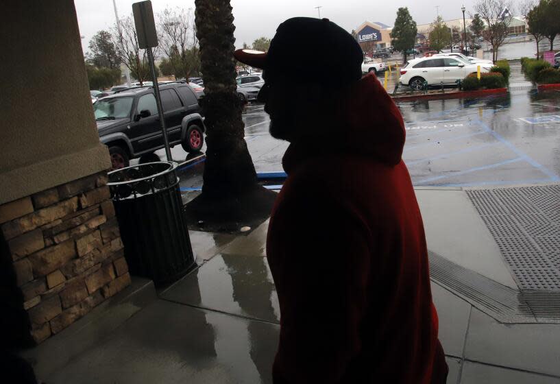 Cesar Hernandez, 37, walks to his car in a shopping center in Moreno Valley on Wednesday, March 29, 2023.
