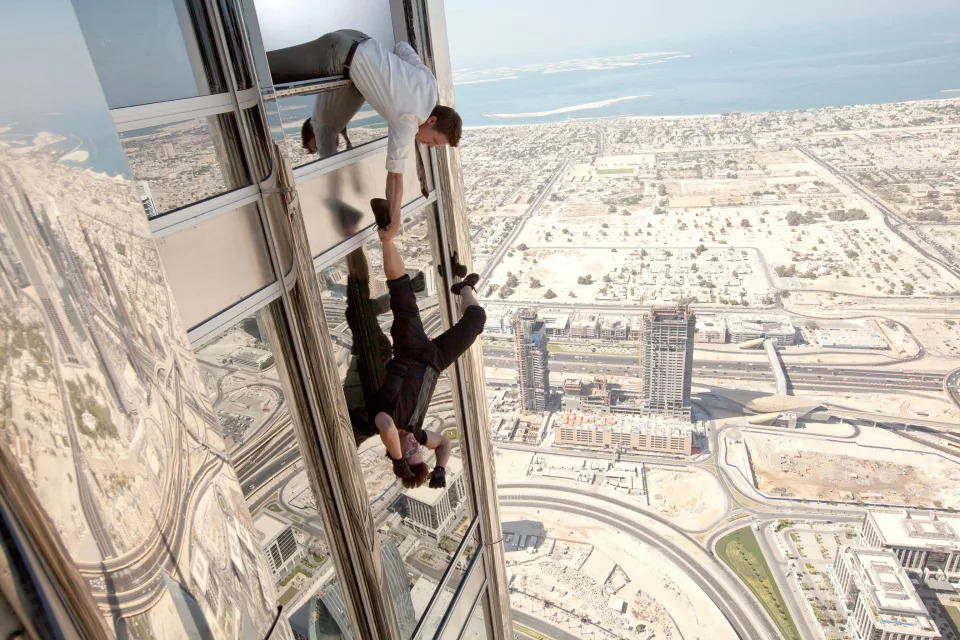 Jeremy Renner gets a firm grasp on Cruise in the skyscraper climb sequence from Mission: Impossible - Ghost Protocol (Photo: David James/©Paramount Pictures/courtesy Everett Collection)