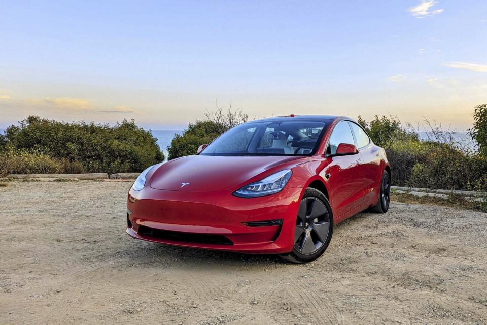 This photo provided by Edmunds shows the Tesla Model 3. The Long Range version boasts more than 300 miles of range as well as all-wheel drive. (Jonathan Elfalan/Edmunds via AP)