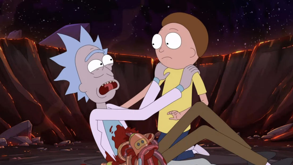  Morty holding injured Rick in Rick and Morty. 