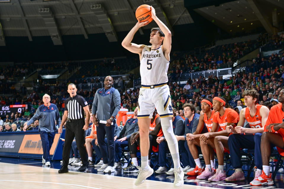 Dec 3, 2022; South Bend, Indiana, USA; Notre Dame Fighting Irish guard Cormac Ryan (5) shoots a three point basket in the first half against the <a class="link " href="https://sports.yahoo.com/ncaab/teams/syracuse/" data-i13n="sec:content-canvas;subsec:anchor_text;elm:context_link" data-ylk="slk:Syracuse Orange;sec:content-canvas;subsec:anchor_text;elm:context_link;itc:0">Syracuse Orange</a> at the Purcell Pavilion. Mandatory Credit: Matt Cashore-USA TODAY Sports