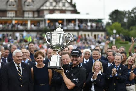 Jul 31, 2016; Springfield, NJ, USA; Jimmy Walker holds up the Wanamaker trophy during the Sunday round of the 2016 PGA Championship golf tournament at Baltusrol GC - Lower Course. Eric Sucar-USA TODAY Sports