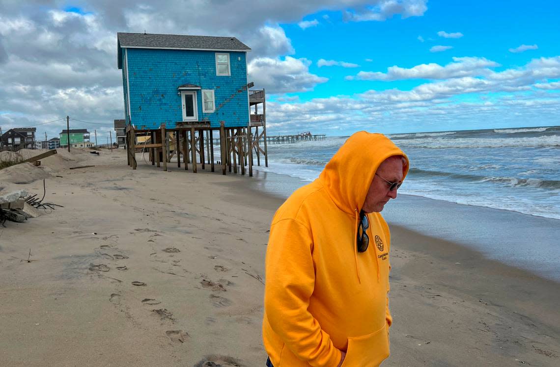 Dare County Commissioner Danny Couch walks along the beach on Ocean Drive in Rodanthe, North Carolina. Last year, three of the street’s beachfront houses collapsed into the sea.