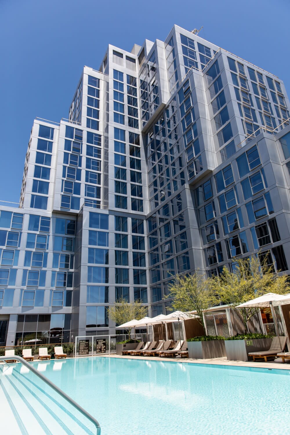 The glass and steel of the Conrad Los Angeles, part of the Grand LA development in downtown Los Angeles.