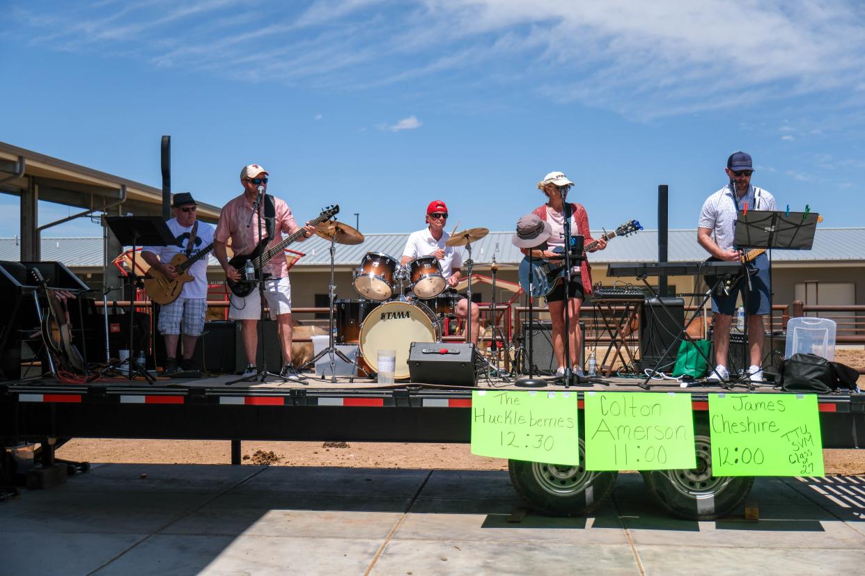 A live band entreats the crowd with music at the Texas Tech School of Veterinary Medicine "Barks and Recreation" event Saturday at Mariposa Station in west Amarillo