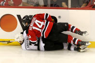 NEWARK, NJ - JUNE 02: Matt Greene #2 of the Los Angeles Kings and Adam Henrique #14 of the New Jersey Devils collide during Game Two of the 2012 NHL Stanley Cup Final at the Prudential Center on June 2, 2012 in Newark, New Jersey. (Photo by Jim McIsaac/Getty Images)