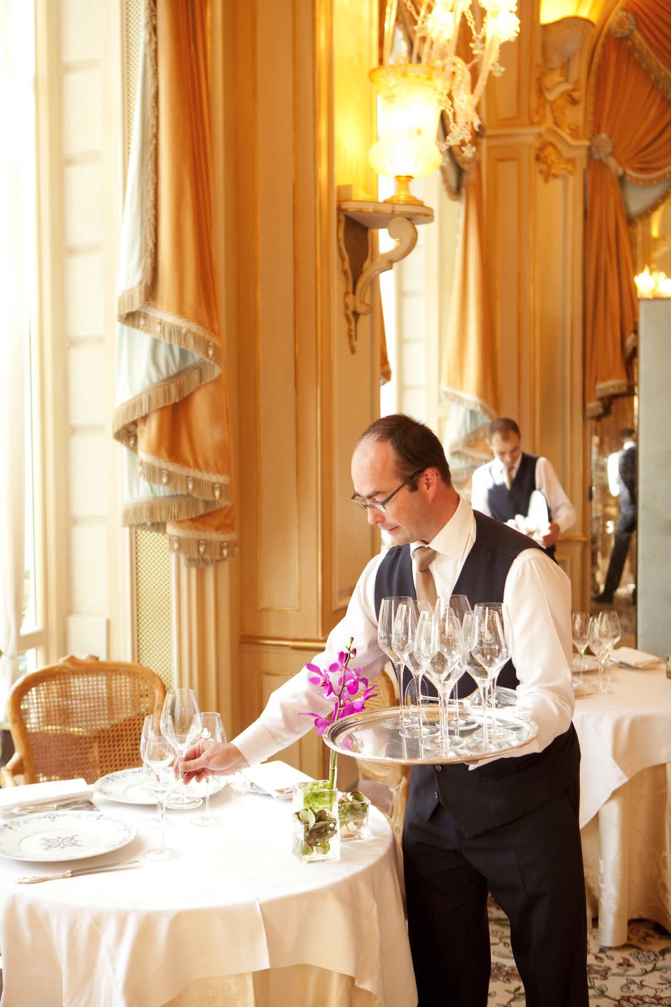 Waiters set the tables in the hotel restaurant L'Espadon in 2009