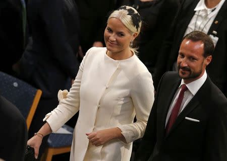 Norway's Crown Princess Mette-Marit and Crown Prince Haakon arrive for the Nobel Peace Prize awards ceremony at the City Hall in Oslo December 10, 2014. REUTERS/Suzanne Plunket