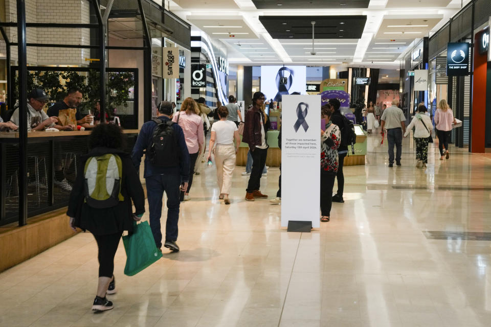 People walk inside the Westfield shopping mall at Bondi Junction in Sydney, Friday, April 19, 2024. The Sydney shopping mall reopened for business on Friday for the first time since it became the scene of a mass stabbing in which six people died on Saturday, April 13. (AP Photo/Mark Baker)