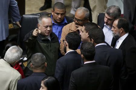 Diosdado Cabello (L), deputy of Venezuela's United Socialist Party (PSUV), gestures during a session of the National Assembly in Caracas, January 13, 2016. REUTERS/Marco Bello