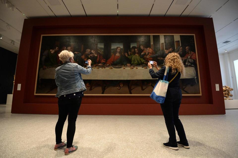 Visitors look at a copy of The Last Supper: PA Wire/PA Images