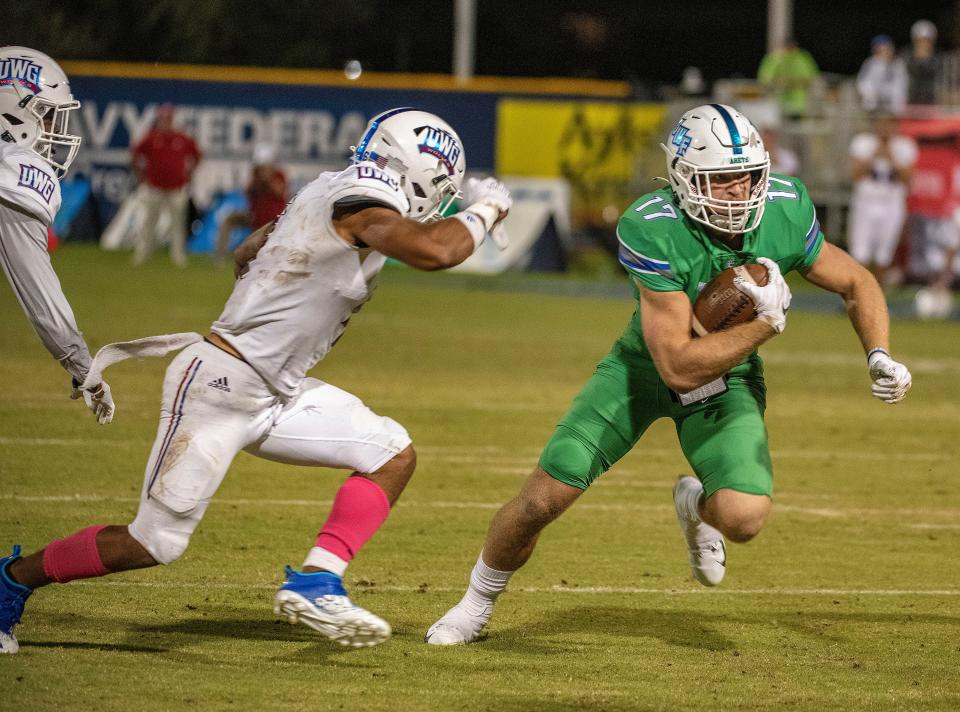 West Florida's David Durden (17) tries for more yardage Saturday, October 16, 2021 during the West Florida West Georgia game at Blue Wahoos Stadium.