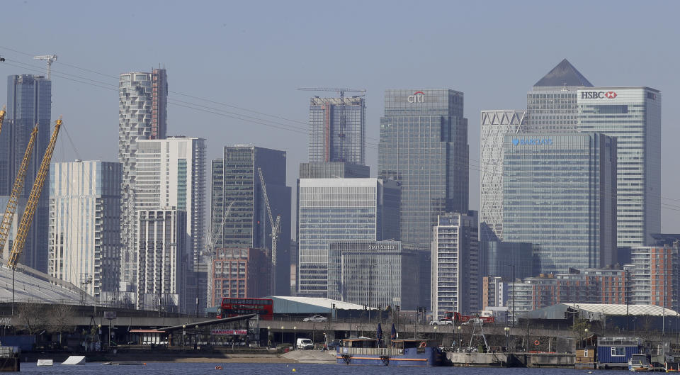 London's financial district in Canary Wharf, London, Wednesday, March 25, 2020. The new coronavirus causes mild or moderate symptoms for most people, but for some, especially older adults and people with existing health problems, it can cause more severe illness or death.(AP Photo/Kirsty Wigglesworth)