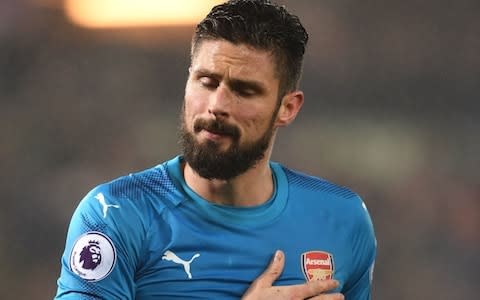 Giroud hand on Arsenal club badge - Credit: Getty Images