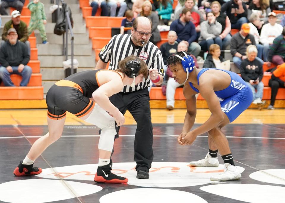 Hudson's Payton Rogers, left, and Dundee's Trey Parker, square off ahead of their 145-pound bout at Wednesday night's LCAA dual meet in Hudson. The Vikings, who are the top-ranked team in Division 3, defeated the D4 No. 1-ranked Tigers 56-16.