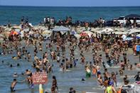 People enjoy Bahia de los Ninos beach in La Guaira, Vargas state, Venezuela