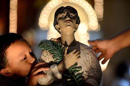 Church bells pealed across the Philippines as millions of Catholics attended special masses to celebrate the canonization of Pedro Calungsod, who was a young missionary killed over 340 years ago