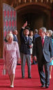 FILE - In this June 15, 2008 file photo, Queen Elizabeth II and Prince Philip, the Duke of Edinburgh, pointing, walk with U.S. President George Bush and his wife Laura, in St George's Hall, Windsor Castle, in Windsor, England. (Nick Ray, Pool Photo via AP, File)