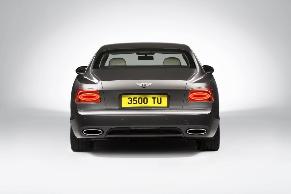 At the rear, a longer and lower boot lid lends a more swept appearance to the side profile. Horizontal single ellipse LED tail lamps combine with a new interpretation of the Bentley “Horse Shoe” feature line, now running the full width of the car and encapsulating a graceful concave section. (Photo: Bentley Motors UK)