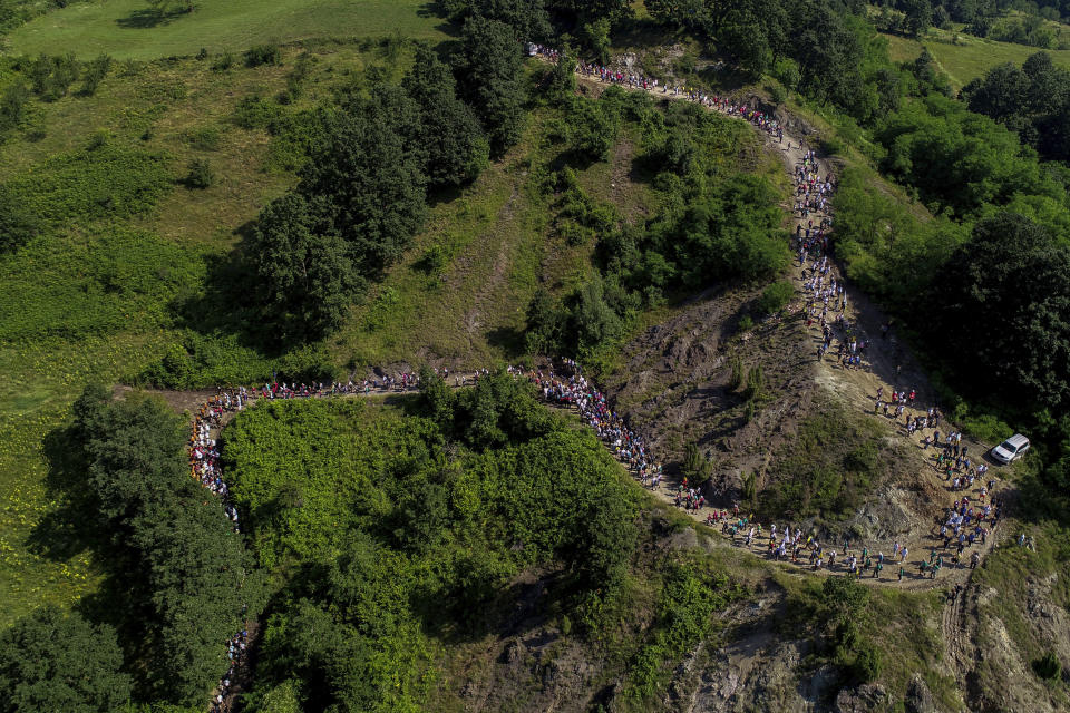 Participants take part in the "March of Peace", march to remember the 1995 Srebrenica massacre, in Nezuk, Bosnia, Saturday, July 8, 2023. A solemn peace march started on Saturday through forests in eastern Bosnia in memory of the 1995 Srebrenica massacre, Europe's only acknowledged genocide since World War II. The 100-kilometre (60-mile) march traces a route taken by Bosniak men and boys as they tried to flee Srebrenica after it was captured by Bosnian Serb forces in the closing days of the country's interethnic war in the 1990s. (AP Photo/Armin Durgut)