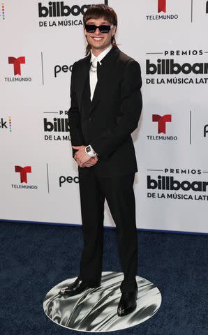 <p>Rodrigo Varela/Getty</p> Peso Pluma attends the 2023 Billboard Latin Music Awards on Oct. 5, 2023 in Florida