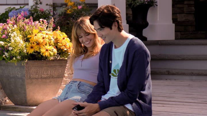  Steven and Taylor sitting by the pool together 